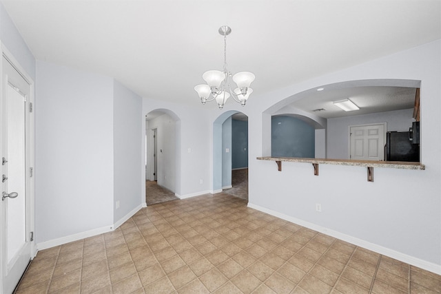 708 Sapphire Blvd, Hewitt, TX 76643 - unfurnished living room featuring a chandelier and arched walkways