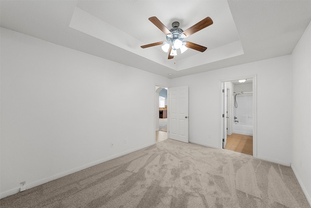 708 Sapphire Blvd, Hewitt, TX 76643 - unfurnished bedroom with a raised ceiling, carpet flooring, arched walkways, and ensuite bath