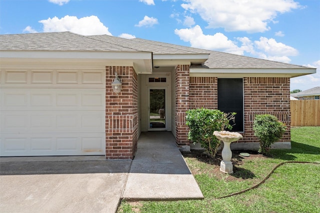 708 Sapphire Blvd, Hewitt, TX 76643 - property entrance with brick siding, a garage, and roof with shingles