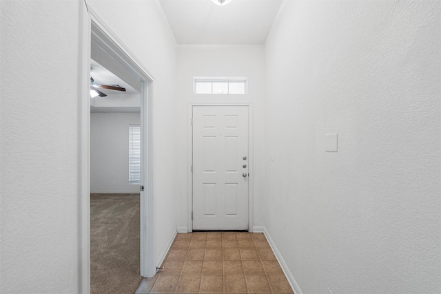708 Sapphire Blvd, Hewitt, TX 76643 - doorway to outside featuring baseboards and tile patterned flooring