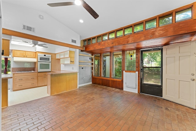 1227 N Irving Heights Dr, Irving, TX 75061 - kitchen featuring a ceiling fan, oven, brick flooring, open floor plan, and high vaulted ceiling