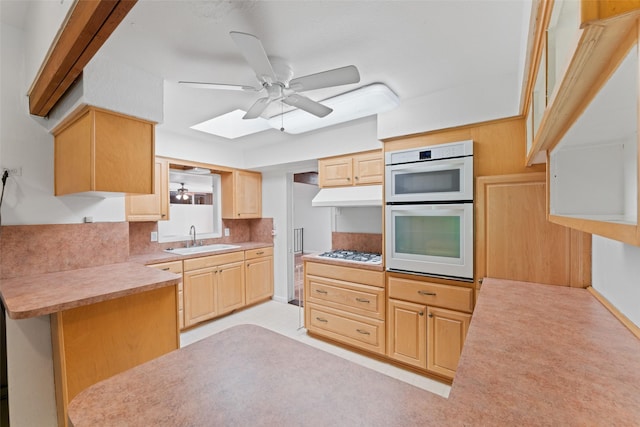 1227 N Irving Heights Dr, Irving, TX 75061 - kitchen with ceiling fan, light brown cabinets, under cabinet range hood, white appliances, and a peninsula