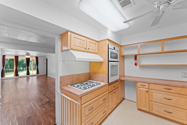 1227 N Irving Heights Dr, Irving, TX 75061 - kitchen with a ceiling fan, white appliances, open shelves, light brown cabinets, and under cabinet range hood