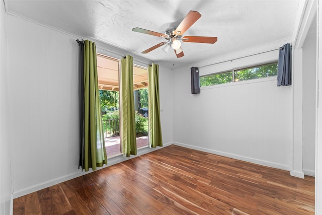 1227 N Irving Heights Dr, Irving, TX 75061 - empty room with wood finished floors and a ceiling fan