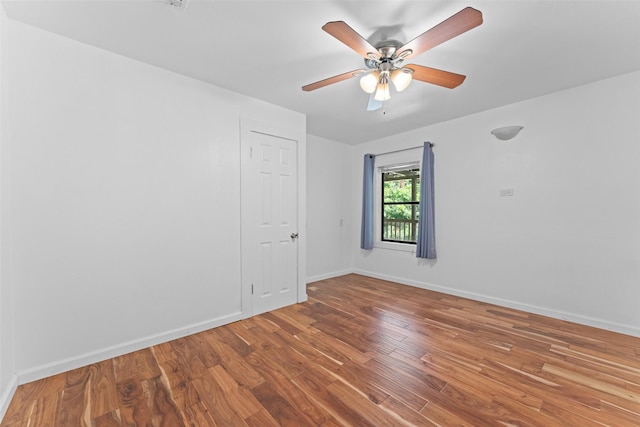 1227 N Irving Heights Dr, Irving, TX 75061 - empty room featuring wood finished floors and a ceiling fan