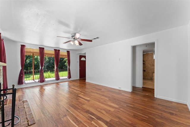 1227 N Irving Heights Dr, Irving, TX 75061 - unfurnished living room featuring a ceiling fan and hardwood / wood-style flooring
