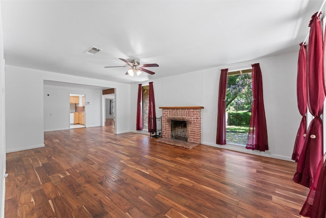 1227 N Irving Heights Dr, Irving, TX 75061 - unfurnished living room with wood finished floors, a fireplace, and ceiling fan
