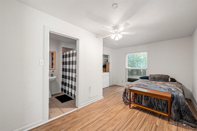 1205 Ashleman St, Bellmead, TX 76705 - bedroom featuring light wood finished floors, ensuite bathroom, and ceiling fan
