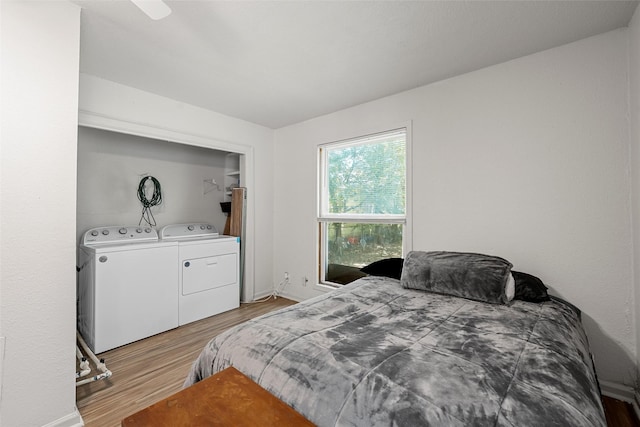 1205 Ashleman St, Bellmead, TX 76705 - bedroom featuring separate washer and dryer and light wood-style floors