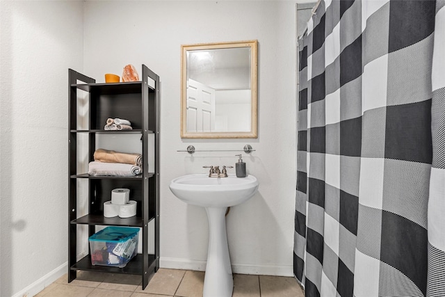 1205 Ashleman St, Bellmead, TX 76705 - full bathroom featuring tile patterned flooring and a shower with curtain