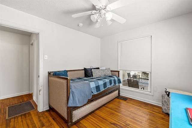 1205 Ashleman St, Bellmead, TX 76705 - bedroom featuring wood-type flooring and ceiling fan