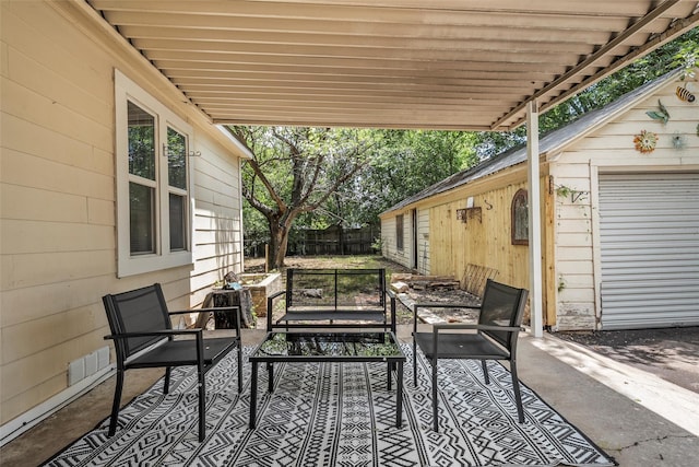 1205 Ashleman St, Bellmead, TX 76705 - view of patio / terrace featuring an outdoor hangout area and an outbuilding