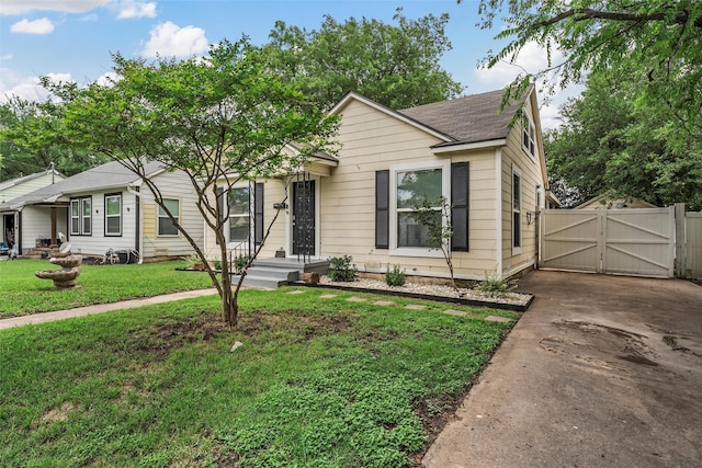 1205 Ashleman St, Bellmead, TX 76705 - view of front of property with a gate and roof with shingles