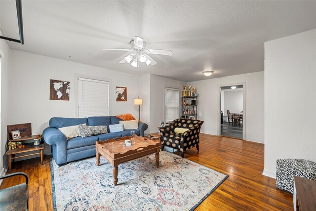 1205 Ashleman St, Bellmead, TX 76705 - living area with a ceiling fan and wood finished floors