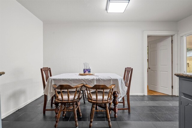 1205 Ashleman St, Bellmead, TX 76705 - dining area with baseboards