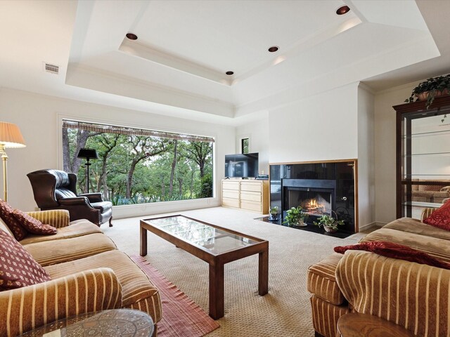 1210 Oak View Ct, Oak Point, TX 75068 - carpeted living area with a tray ceiling and a fireplace with flush hearth