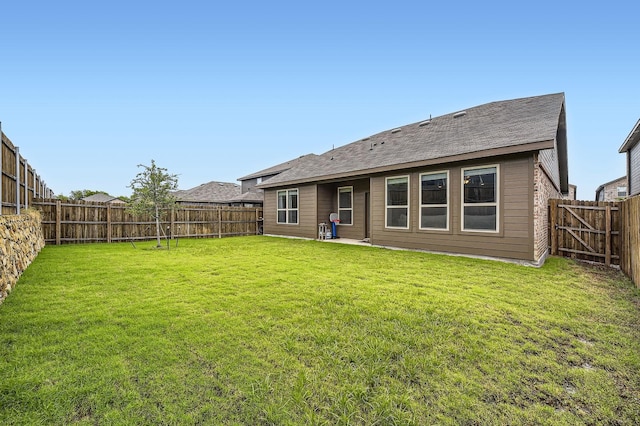 8009 Gangway Dr, Fort Worth, TX 76179 - rear view of house with a fenced backyard and a shingled roof