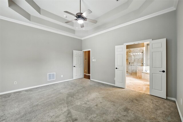 2908 Carterton Ct, Flower Mound, TX 75022 - unfurnished bedroom with a tray ceiling, carpet flooring, crown molding, a towering ceiling, and ensuite bathroom