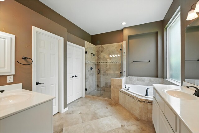 2908 Carterton Ct, Flower Mound, TX 75022 - bathroom featuring two vanities, a stall shower, a bath, and recessed lighting