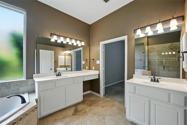 2908 Carterton Ct, Flower Mound, TX 75022 - full bathroom with two vanities, a bath, a stall shower, and tile patterned floors