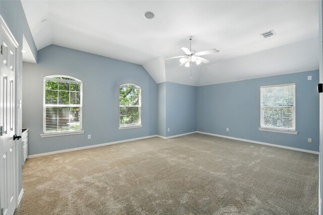 2908 Carterton Ct, Flower Mound, TX 75022 - empty room with lofted ceiling, ceiling fan, and light colored carpet