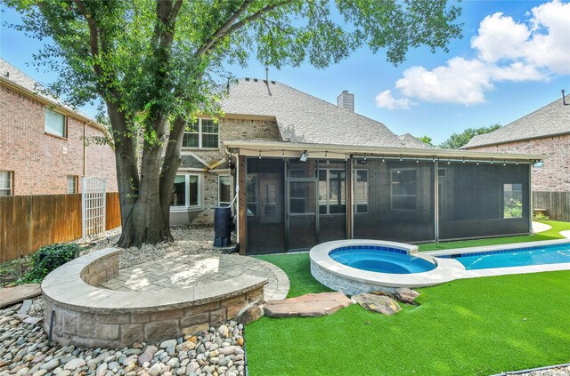 2908 Carterton Ct, Flower Mound, TX 75022 - back of house featuring a sunroom, a chimney, a fenced backyard, and brick siding