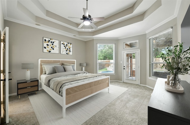 2908 Carterton Ct, Flower Mound, TX 75022 - bedroom featuring access to exterior, a tray ceiling, light colored carpet, ceiling fan, and crown molding