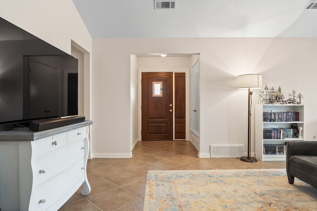 7220 Elderberry Ln, Dallas, TX 75249 - foyer entrance featuring light tile patterned floors and baseboards