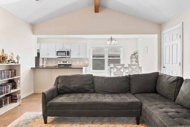 7220 Elderberry Ln, Dallas, TX 75249 - living room featuring a chandelier, light tile patterned flooring, and lofted ceiling