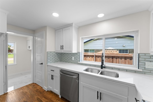 1315 Dunbarton Dr, Richardson, TX 75081 - kitchen with stainless steel dishwasher, backsplash, light countertops, white cabinetry, and recessed lighting