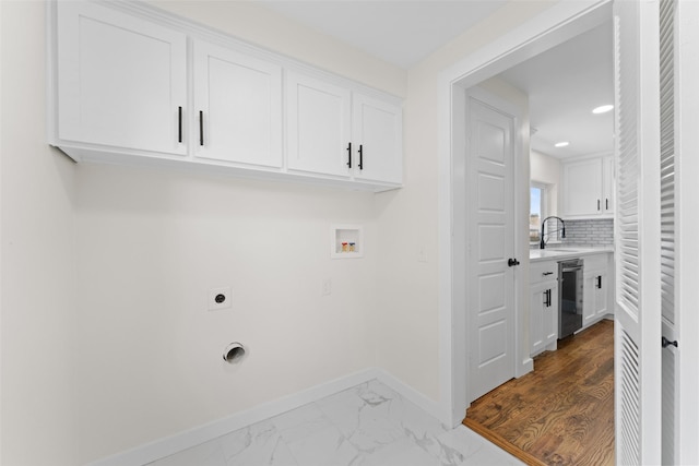 1315 Dunbarton Dr, Richardson, TX 75081 - washroom with hookup for an electric dryer, cabinet space, washer hookup, recessed lighting, and marble finish flooring