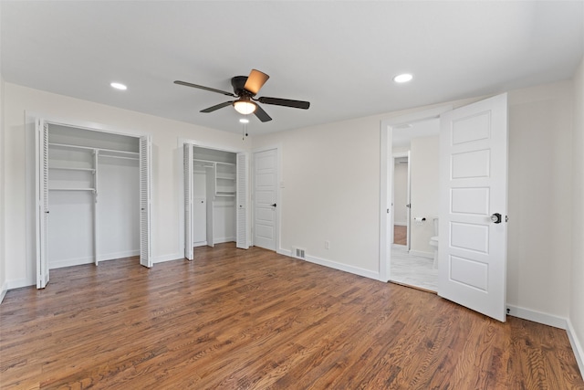 1315 Dunbarton Dr, Richardson, TX 75081 - unfurnished bedroom with multiple closets, wood finished floors, recessed lighting, and a ceiling fan