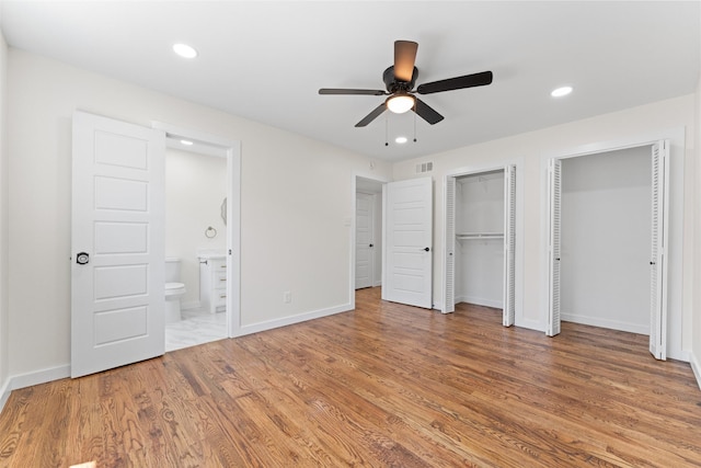 1315 Dunbarton Dr, Richardson, TX 75081 - unfurnished bedroom featuring multiple closets, light wood-type flooring, recessed lighting, ensuite bathroom, and a ceiling fan