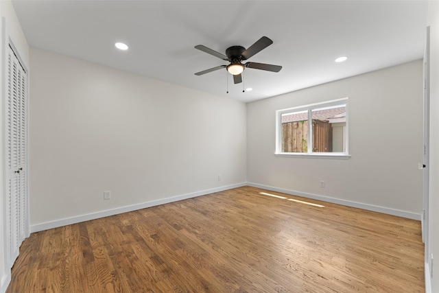 1315 Dunbarton Dr, Richardson, TX 75081 - unfurnished bedroom with wood finished floors, recessed lighting, a ceiling fan, and a closet