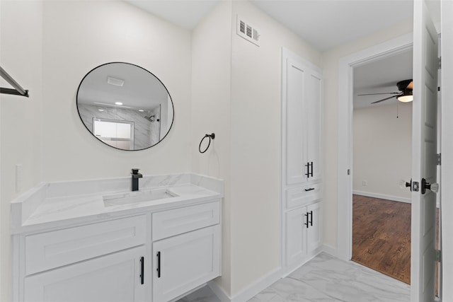 1315 Dunbarton Dr, Richardson, TX 75081 - bathroom with vanity, marble finish flooring, and ceiling fan