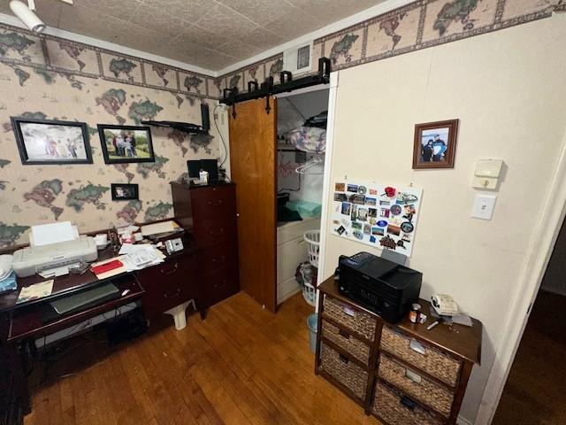 4411 Marigold Trl, Mesquite, TX 75150 - office space featuring a barn door and wood finished floors