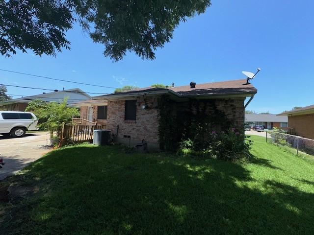 4411 Marigold Trl, Mesquite, TX 75150 - view of property exterior featuring brick siding and a cooling unit