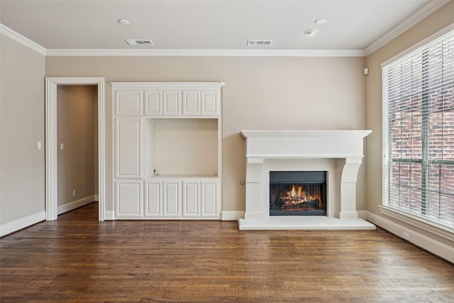 1316 Comal Dr, Allen, TX 75013 - unfurnished living room featuring wood finished floors, ornamental molding, plenty of natural light, a lit fireplace, and recessed lighting