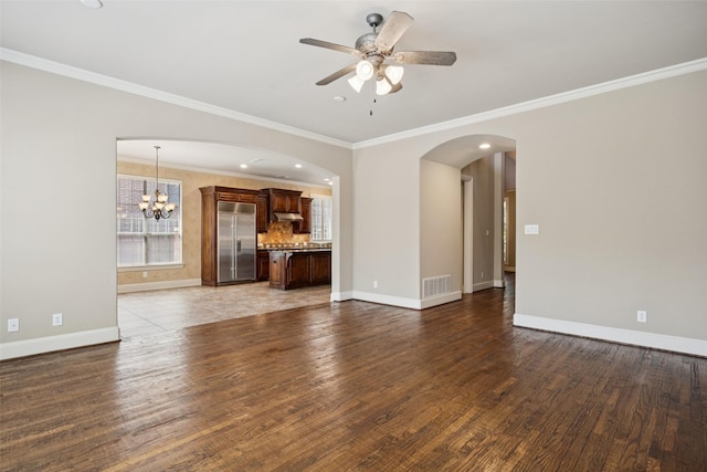 1316 Comal Dr, Allen, TX 75013 - unfurnished living room with plenty of natural light, a chandelier, wood finished floors, ornamental molding, and recessed lighting