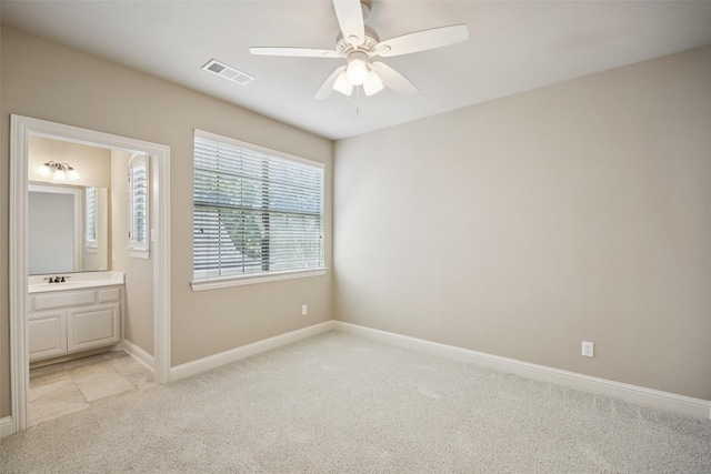 1316 Comal Dr, Allen, TX 75013 - unfurnished bedroom with light colored carpet, connected bathroom, and ceiling fan