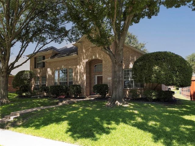 9705 Southern Hills Dr, Plano, TX 75025 - view of front facade featuring brick siding and a front yard