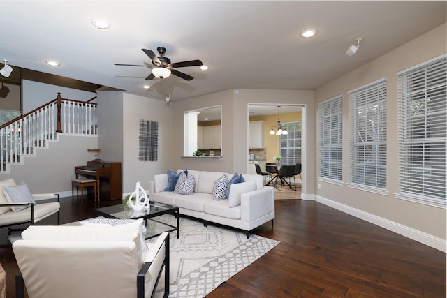 9705 Southern Hills Dr, Plano, TX 75025 - living area featuring dark wood-type flooring, stairs, a ceiling fan, recessed lighting, and a chandelier