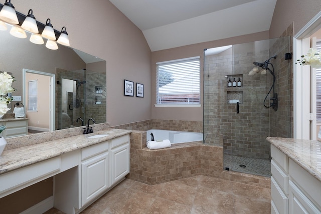 9705 Southern Hills Dr, Plano, TX 75025 - bathroom with vaulted ceiling, vanity, a stall shower, and a garden tub