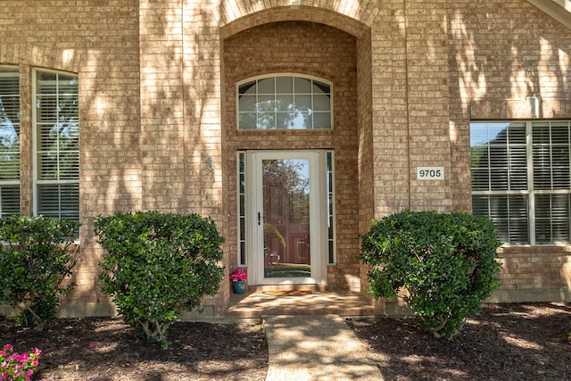 9705 Southern Hills Dr, Plano, TX 75025 - doorway to property with brick siding