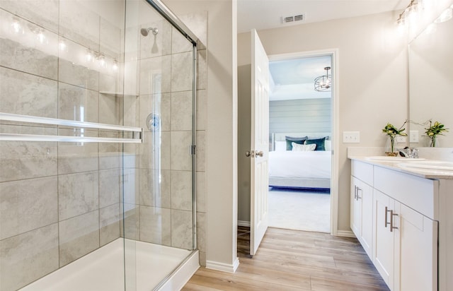 14159 Maida Dr, Pilot Point, TX 76258 - bathroom with double vanity, wood finished floors, ensuite bathroom, and a shower stall