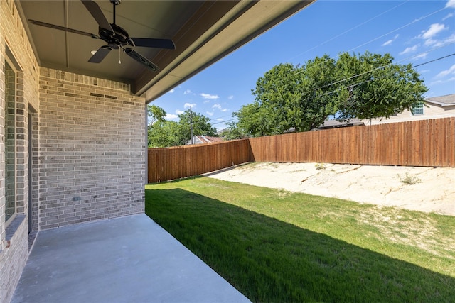 2700 NW 22nd St, Fort Worth, TX 76106 - fenced backyard featuring ceiling fan and a patio area