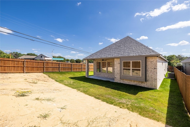 2700 NW 22nd St, Fort Worth, TX 76106 - back of property with roof with shingles, brick siding, a fenced backyard, ceiling fan, and a patio
