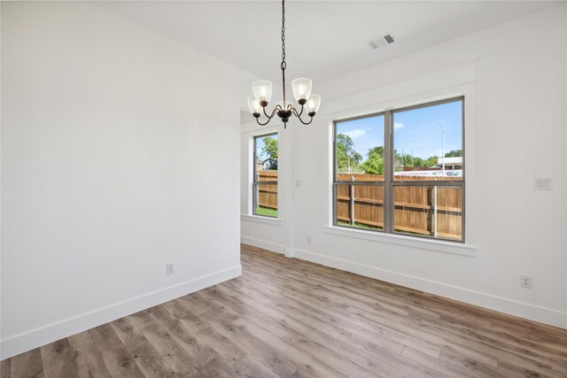 2700 NW 22nd St, Fort Worth, TX 76106 - unfurnished room with a chandelier and wood finished floors