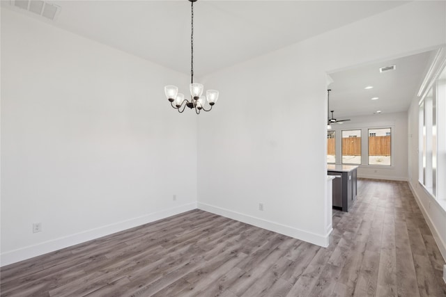 2700 NW 22nd St, Fort Worth, TX 76106 - unfurnished dining area featuring light wood-style flooring, a chandelier, a ceiling fan, and recessed lighting