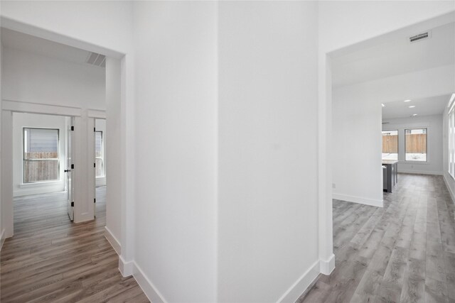 2700 NW 22nd St, Fort Worth, TX 76106 - hallway featuring wood finished floors and baseboards